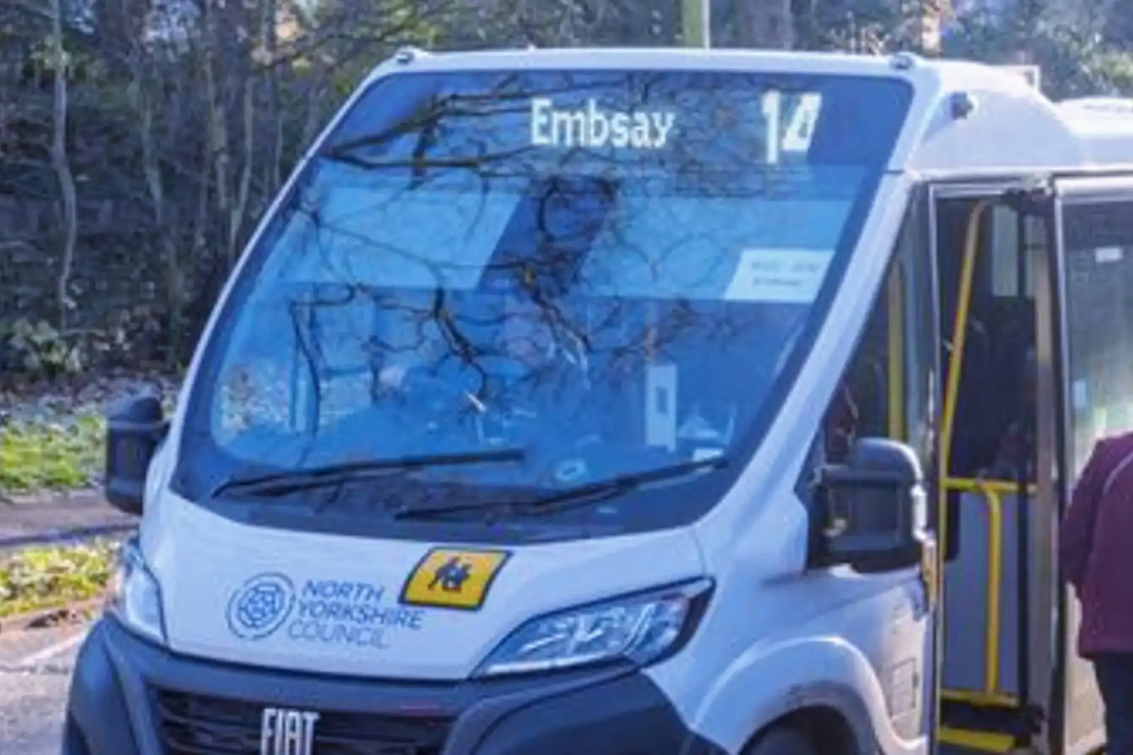 A number 14 bus at a bus stop in Embsay